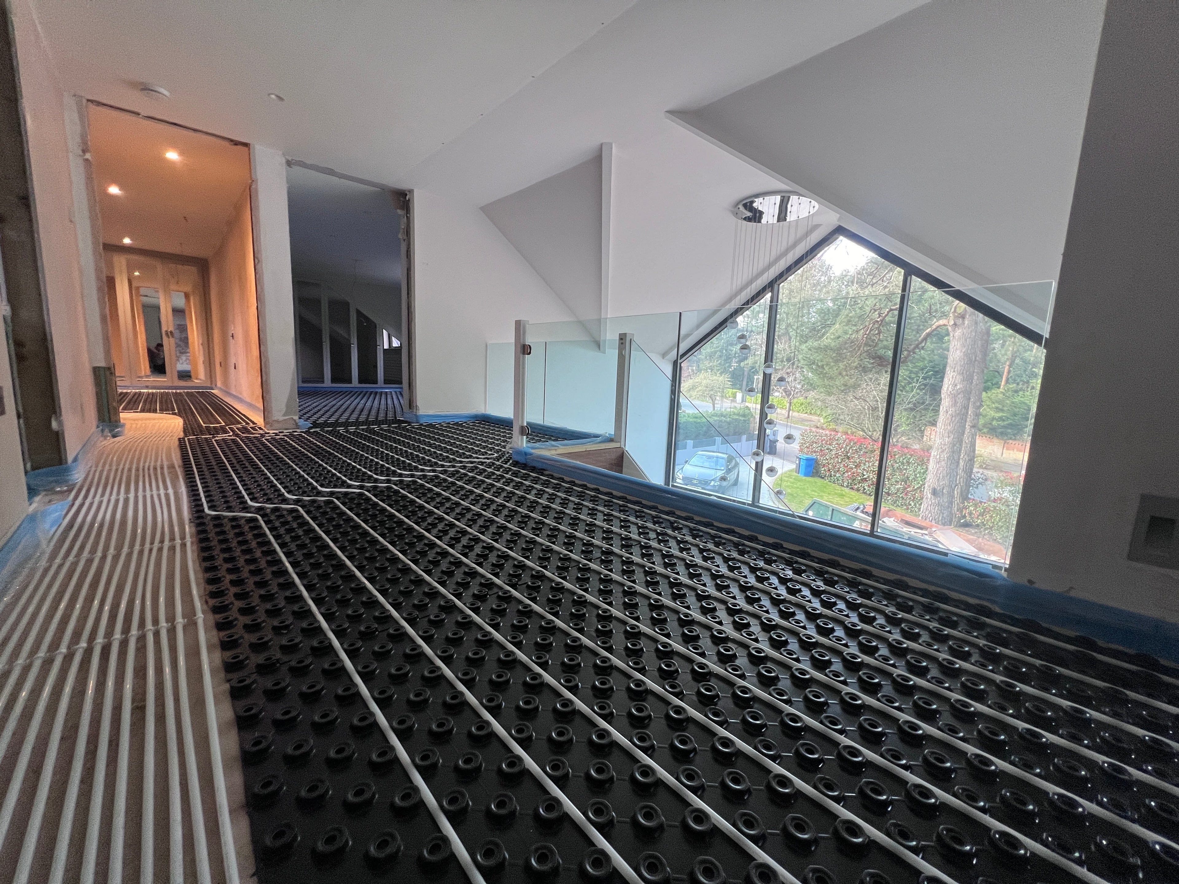 Water underfloor heating being installed