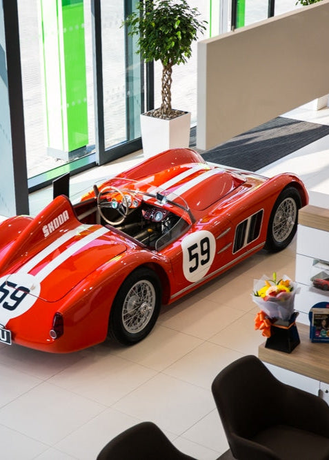 Red and white Skoda vintage race car